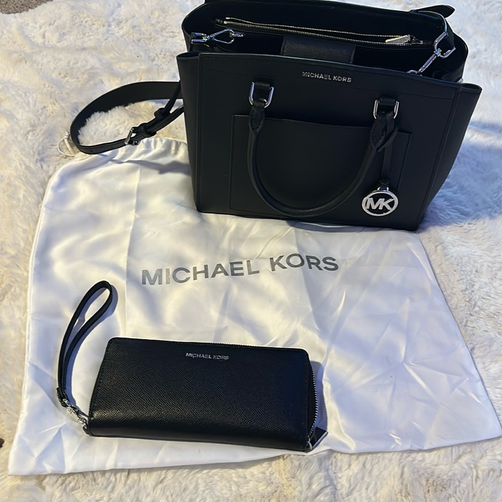 Black, Michael Kors purse and wallet  set kept in a dust bag